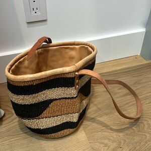 Leather and straw bucket bag